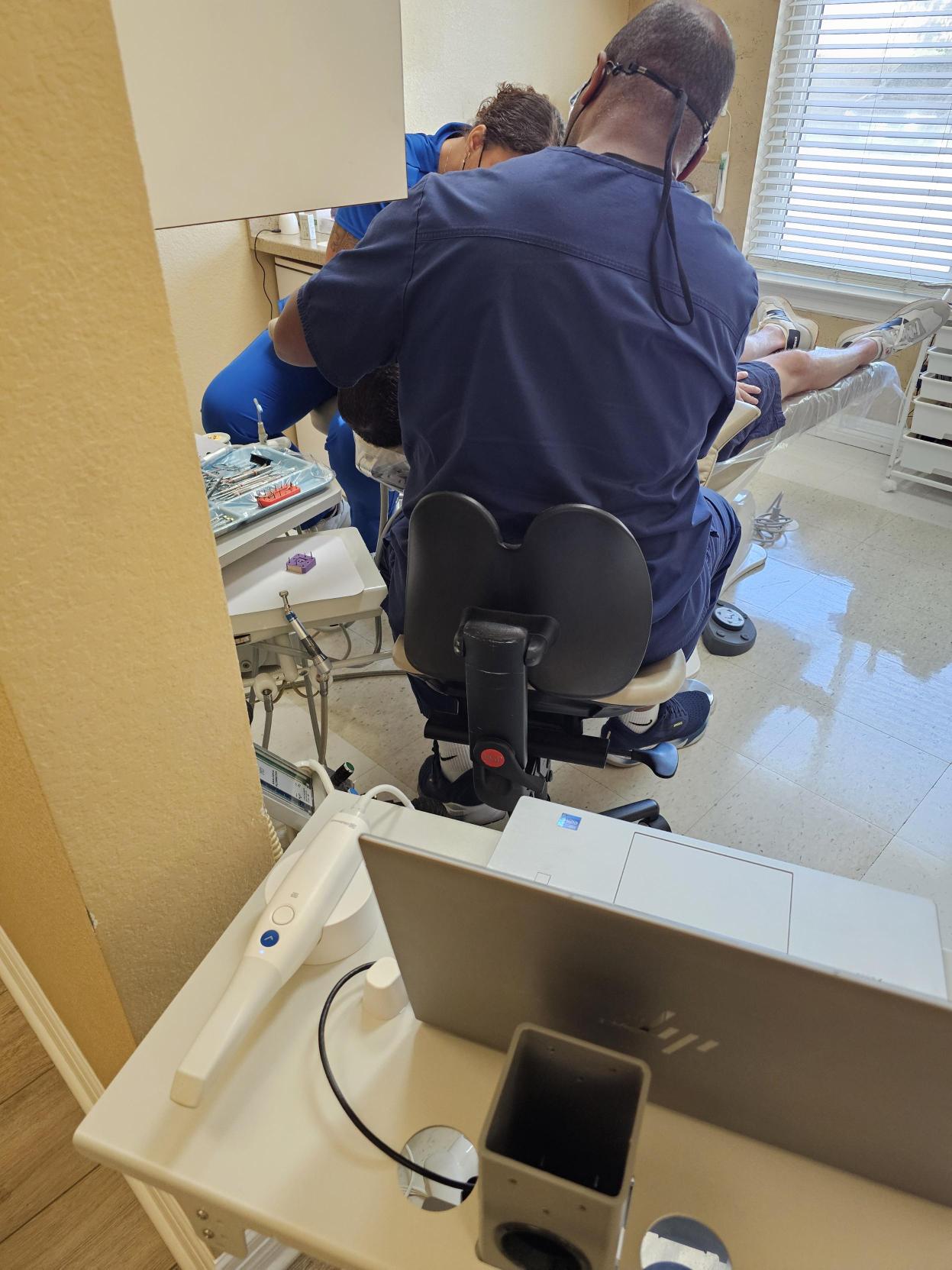 patient getting a limited dental exam